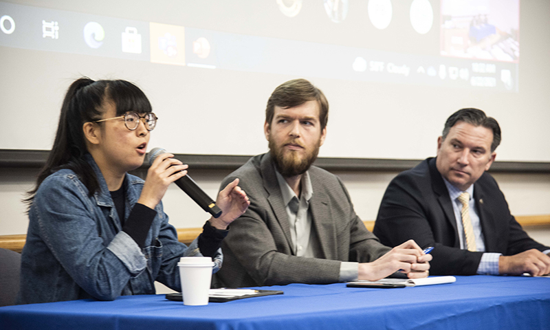 Defense Analysis faculty members speaking at a conference